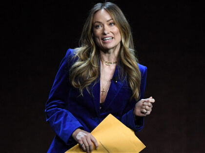 US director and actress Olivia Wilde holds an envelope reading "personal and confidential" as she speaks onstage during the Warner Bros. Pictures "The Big Picture" presentation during CinemaCon 2022 at Caesars Palace on April 26, 2022 in Las Vegas, Nevada. (Photo by VALERIE MACON / AFP) (Photo by VALERIE MACON/AFP …