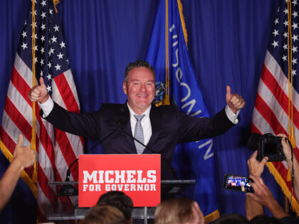 WAUKESHA, WISCONSIN - AUGUST 09: Republican gubernatorial candidate Tim Michels greets gue