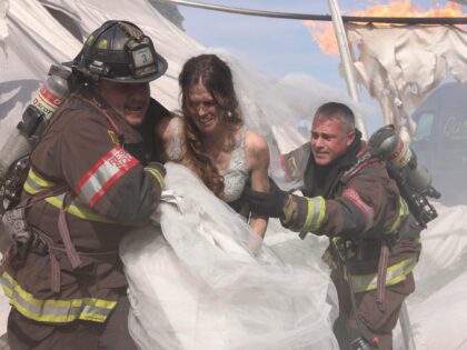 CHICAGO FIRE -- "Hold on Tight" Episode 1101 -- Pictured: (l-r) Anthony Ferraris as Tony, Georgia Lee King as Bride, Taylor Kinney as Kelly Severide-- (Photo by: Adrian S Burrows Sr/NBC via Getty Images)