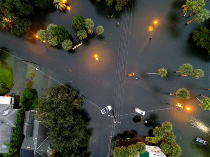 ORLANDO, FLORIDA - SEPTEMBER 29: In this aerial view, cars sit in floodwater near downtown