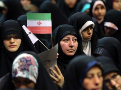 Iranian women attend a rally in support of wearing headscarves at the Sahhid Shiroudi Stad