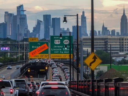 JERSEY CITY, NY - AUGUST 17: The Empire State Building and Tourist District are seen while Traffic jam is reported along the route to New York City on August 17, 2022, in Jersey City, New Jersey. New York Governor. Kathy Hochul is proposing a congestion pricing plan to raise billions …