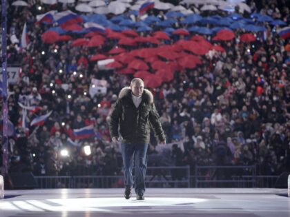 TOPSHOT - Russian President Vladimir Putin attends a concert marking the seventh anniversary of Russia's annexation of Crimea at the Luzhniki stadium in Moscow on March 18, 2021. (Photo by Alexey DRUZHININ / SPUTNIK / AFP) (Photo by ALEXEY DRUZHININ/SPUTNIK/AFP via Getty Images)