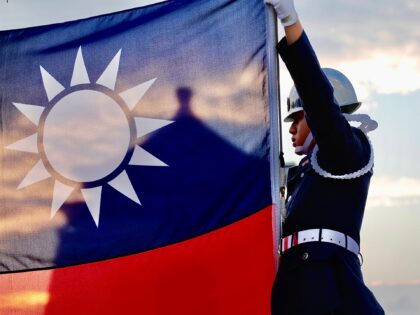 TAIPEI, TAIWAN - 2020/11/15: Tri-Service Honour (Honor) Guards raise Taiwans national flag in the morning, amidst the spread of the global pandemic disease covid-19, at Liberty Square, in Taipei. With escalated tensions with China and successful containment of the coronavirus, Taiwans flag raising ceremony remains unchanged and daily life amongst …