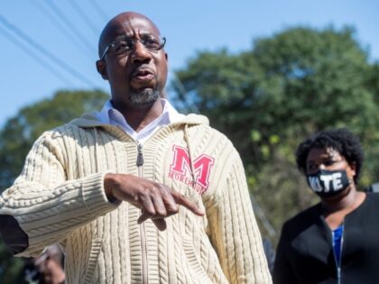 UNITED STATES - NOVEMBER 3: Rev. Raphael Warnock, Democratic candidate for Georgia senate, speaks with supporters near Coan Park in Atlanta, Ga., on Tuesday, November 3, 2020. Stacey Abrams, former candidate for Georgia governor, appears at right. (Photo By Tom Williams/CQ-Roll Call, Inc via Getty Images)