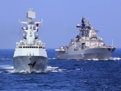ONBOARD GUANGZHOU, Sept. 16, 2016 -- Chinese frigate "Huangshan" and Russian Navy's Antisu