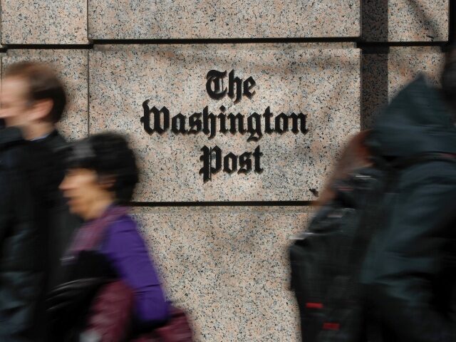 FILE - People walk by the One Franklin Square Building, home of The Washington Post newspaper, in downtown Washington on Feb. 21, 2019. The Washington Post has fired reporter Felicia Sonmez, who has triggered a vigorous online debate this past week over social media policy and public treatment of colleagues. …