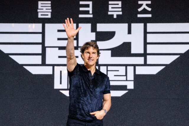 Actor Tom Cruise waves during a press conference in Seoul, South Korea for 'Top Gun: Maver