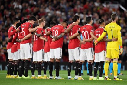 Manchester United players during a minute's silence following the death of Queen Elizabeth