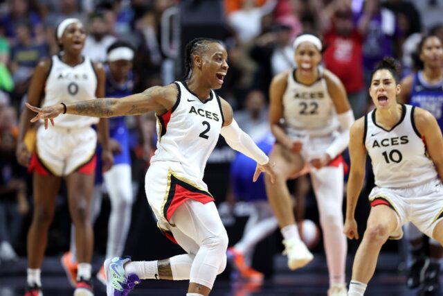Riquna Williams of the Las Vegas Aces celebrates during the fourth quarter of the team's W