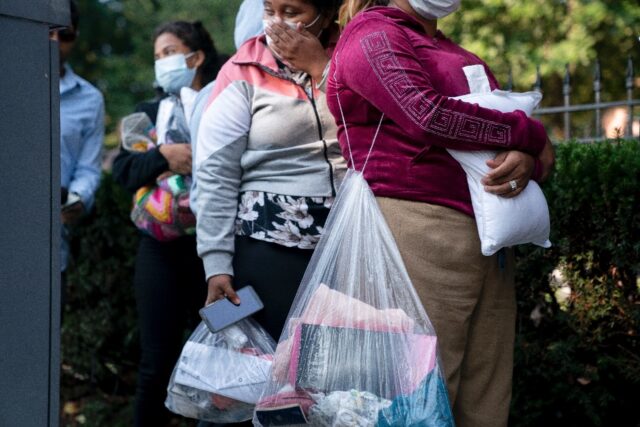 Venezuelan migrants, sent from Texas, in front of the official Washington residence of US