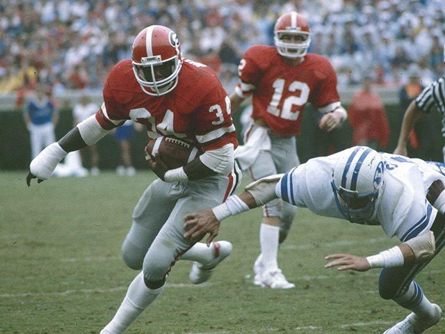 Georgia running back Herschel Walker (34) is seen in action, 1982. (AP Photo)