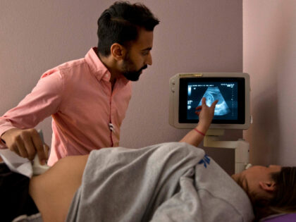 SOCIAL VALUES: Dr. Bhavik Kumar, 31, listens to a question from a patient considering abortion during her ultrasound at the Whole Woman's Health clinic in Fort Worth, Texas, on Friday, June 3, 2016. Women considering abortion are required by the state to have a sonogram that they must be offered …