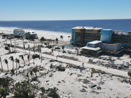 In this photo taken with a drone, debris and damaged buildings are seen two days after the passage of Hurricane Ian, in Fort Myers Beach, Fla., Friday, Sept. 30, 2022. (AP Photo/Rebecca Blackwell)