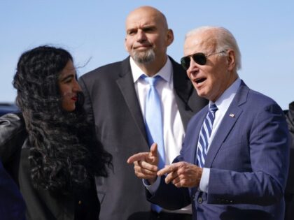 President Joe Biden talks with Pennsylvania Lt. Gov. John Fetterman, a Democratic candidate for U.S. Senate, second from left, and his wife Gisele Barreto Fetterman, left, as he arrives, Thursday, Oct. 20, 2022, at the 171st Air Refueling Wing at Pittsburgh International Airport in Coraopolis, Pa. Pennsylvania Gov. Tom Wolf, …