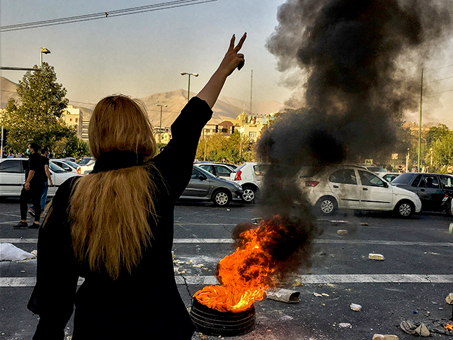 In this photo taken by an individual not employed by the Associated Press and obtained by the AP outside Iran, Iranians protests the death of 22-year-old Mahsa Amini after she was detained by the morality police, in Tehran, Oct. 1, 2022. Iran’s atomic energy agency alleged Sunday, Oct. 23, 2022, that hackers acting on behalf of an unidentified foreign country broke into a subsidiary’s network and had free access to its email system. Sunday's hack comes as Iran continues to face nationwide unrest first sparked by the Sept. 16 death of Mahsa Amini, a 22-year-old woman in police custody. (AP Photo/Middle East Images, File)
