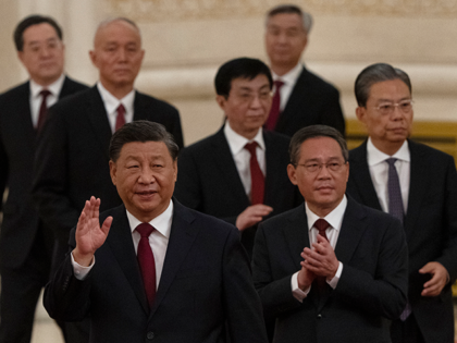 New members of the Politburo Standing Committee, front to back, President Xi Jinping, Li Qiang, Zhao Leji, Wang Huning, Cai Qi, Ding Xuexiang, and Li Xi arrive at the Great Hall of the People in Beijing on Oct. 23, 2022. The world faces the prospect of more tension with China …
