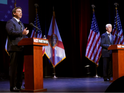 Florida's Republican Gov. Ron DeSantis, left, speaks during a debate with his Democratic opponent Charlie Crist in Fort Pierce, Fla., Monday, Oct. 24, 2022. (Crystal Vander Weit/TCPalm.com via AP, Pool)