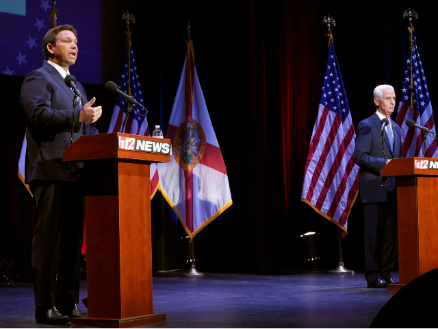 Florida's Republican Gov. Ron DeSantis, left, speaks during a debate with his Democratic o