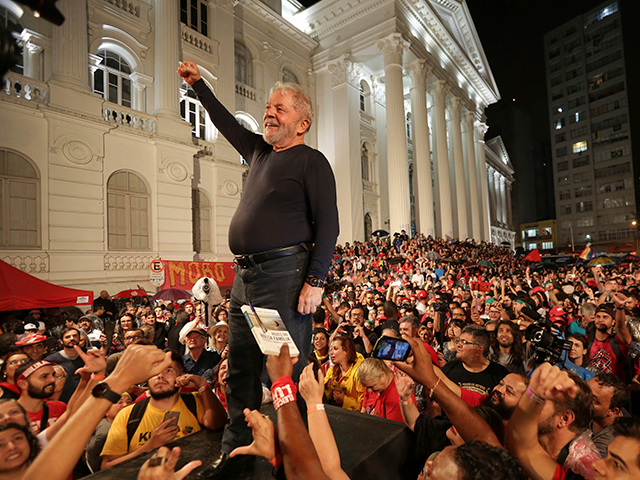 Brazil's former President Luiz Inacio Lula da Silva stands amid supporters during the fina