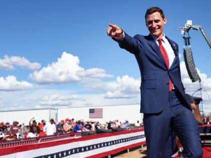 Republican candidate for U.S. Senate Blake Masters gestures to the crowd at a campaign ral