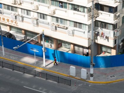 SHANGHAI, CHINA - OCTOBER 25, 2022 - Blue iron walls are used to temporarily isolate and control a residential community and shops along the street in Shanghai, China, on Oct 25, 2022. (CFOTO/Future Publishing via Getty Images)