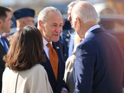 US President Joe Biden(R) is greeted by US Senate Majority Leader Chuck Schumer (C) and New York Governor Kathy Hochul (L) as Biden arrives at Hancock International Airport in Syracuse, New York, on October 27, 2022. (MANDEL NGAN/AFP via Getty Images)