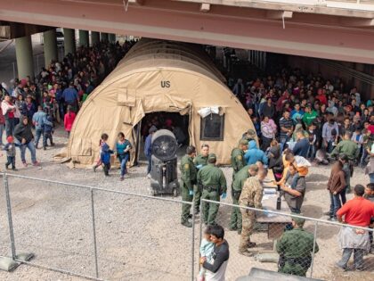 El Paso Sector Border Patrol agents process increasingly large migrant groups. (CBP File P