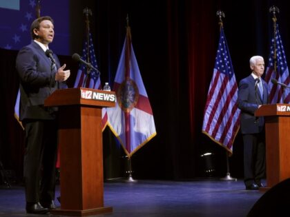Florida's Republican Gov. Ron DeSantis and his Democratic opponent Charlie Crist take to the stage for their scheduled debate in Fort Pierce, Florida, Monday, Oct. 24, 2022. (Crystal Vander Weit/TCPalm.com via AP, Pool)