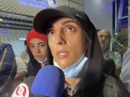 In this image taken from video by Iran's state-run IRNA news agency, Iranian competitive climber Elnaz Rekabi speaks to journalists in Imam Khomeini International Airport in Tehran, Iran, Wednesday, Oct. 19, 2022. Rekabi received a hero's welcome on her return to Tehran early Wednesday, after competing in South Korea without …