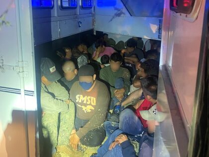 Agents arrested two armed human smugglers with 33 migrants locked in a horse trailer. (U.S. Border Patrol/Tucson Sector)