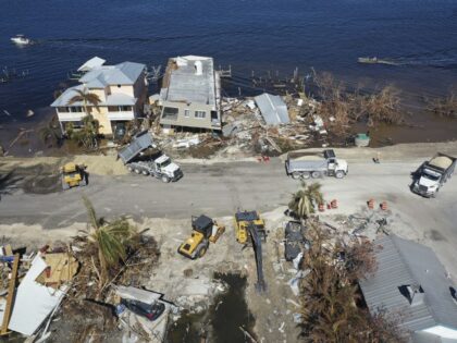 In this aerial view, construction crews work around the clock to make temporary repairs to a bridge on the island of Matlacha on October 5, 2022 in Matlacha, Florida. Florida Gov. Ron DeSantis delivered remarks about the completion of the bridge to reconnect the island, and Pine Island as well, …