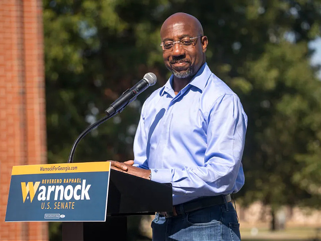 COLUMBUS, GA - OCTOBER 08: Senator Rev.  Raphael Warnock speaks with supporters during his campaign tour, outside the Liberty Theater on October 8, 2022 in Columbus, Georgia.  Warnock is running for reelection against Republican candidate Herschel Walker (Photo by Megan Varner/Getty Images)