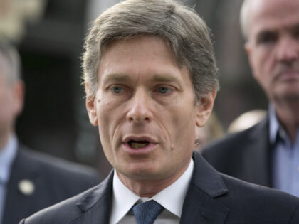 Tom Malinowski, a Democrat from New Jersey, second left, speaks during a news conference before the signing of a NJ Transit reform bill at Summit Train station in Summit, New Jersey, U.S., on Thursday, Dec. 20, 2018. The bill includes reforms to NJ Transit's board of directors; expands oversight, both …