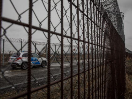BUDAPEST, HUNGARY - JANUARY 18: Police patrol the Hungarian border fence with Serbia on January 18, 2019 outside Szeged, Hungary. In 2015 thousands of migrants massed on the Hungarian border. The situation pushed Prime Minister Vicktor Orban’s government to build a fence along it’s borders with Serbia, the resulting thirteen-foot-tall …