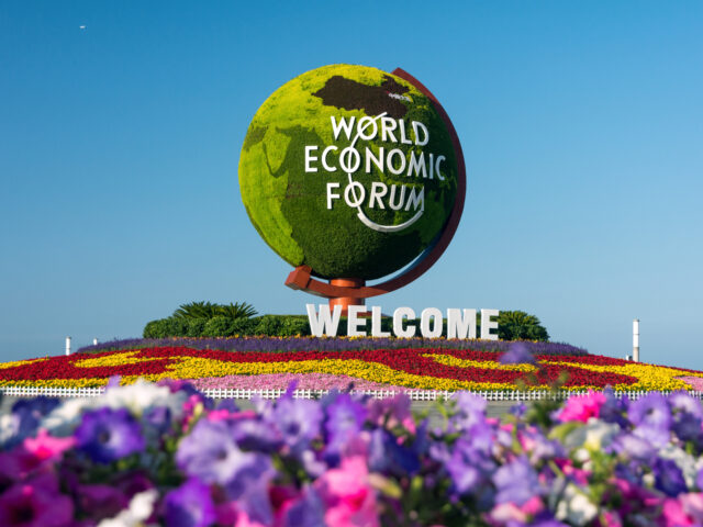 DALIAN, CHINA - JUNE 11: A flower parterre with the logo reading 'World Economic Forum' is seen ahead of the World Economic Forum Annual Meeting of the New Champions 2019 at Dalian International Conference Center on June 11, 2019 in Dalian, Liaoning Province of China. The World Economic Forum Annual …