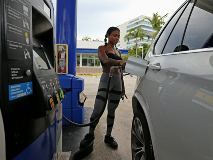 Suni Sweeney fills up her car with gasoline at Marathon gas station Friday, Aug. 30, 2019 in Aventura, Fla., as the state prepares for Hurricane Dorian. (David Santiago/Miami Herald/Tribune News Service via Getty Images)