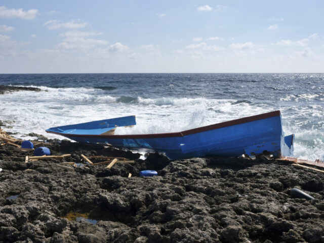 LAMPEDUSA (SICILY), ITALY - OCTOBER 21, 2019: The remains of a migrant's boat barely