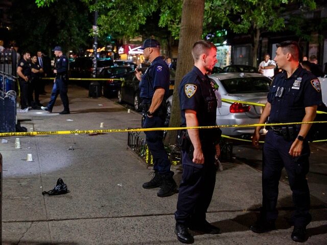 New York City Police Department (NYPD) officers investigate the scene where a women was shot and killed in the Brooklyn borough of New York, U.S., on Wednesday, August 4, 2021. New York Democratic mayoral nominee Eric Adams said after a meeting with President Joe Biden that the availability of handguns is driving increases in …