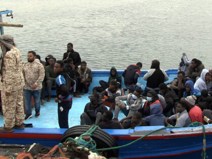 TRIPOLI, LIBYA - OCTOBER 19: Migrants wait to be returned by Libyan Coast Guard 33 kilometers off the coast of Garabulli, 60 kilometres (40 miles) east of the capital Tripoli on October 19, 2021. A boat carrying irregular migrants were returned by Libyan Coast Guard. Thousands of irregular migrants are …