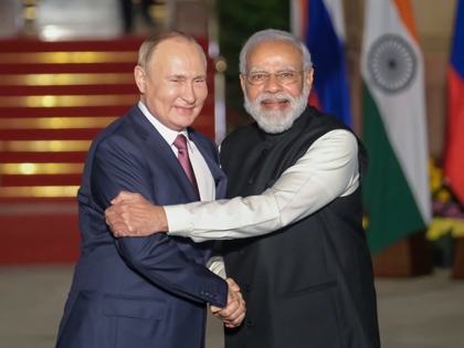 Narendra Modi, India's prime minister, right, and Vladimir Putin, Russia's president, pose for photographs as Putin arrives at Hyderabad House in New Delhi, India, on Monday, Dec. 6, 2021. Putin visits New Delhi as billions of dollars of Russian weaponry flow into India that would normally attract U.S. sanctions. Eager …