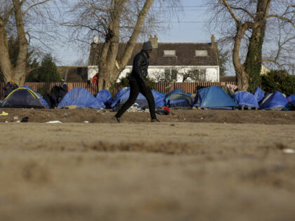 ââââââââââââââCALAIS, FRANCE - DECEMBER 22: A migrant walks towards his tent in the informal camp in Calais, France on December 22, 2021. (Photo by Eduardo Oyana/Anadolu Agency via Getty Images)