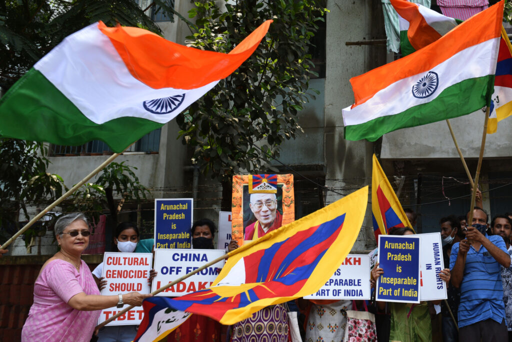 KOLKATA, INDIA  APRIL 23: Supporters of the Dalai Lama seen with his portrait, posters, flags of Tibet and India, as they participate in a sit-in protest against China on Tibet issue and also with regard to Ladakh and Arunachal in front of the Chinese consulate, on April 23, 2022 in Kolkata, India. (Photo by Samir Jana/Hindustan Times via Getty Images)