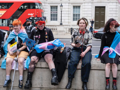 Hundreds of trans rights activists gathered in Westminster for a protest rally under the n