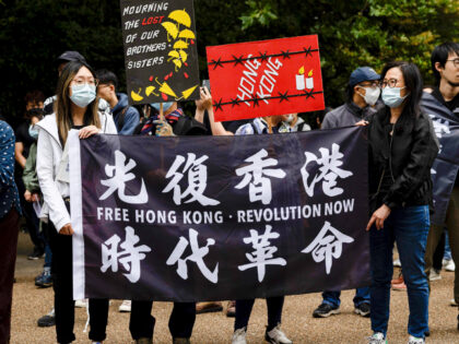 LONDON, UNITED KINGDOM - 2022/07/01: Protesters hold a flag of "Free Hong Kong, Revolution Now" during a rally outside the Hong Kong Economic and Trade Office in London. Hundreds of Hongkongers residing in London gathered on the 25th anniversary of the handover of Hong Kong to protest against the authoritarian …