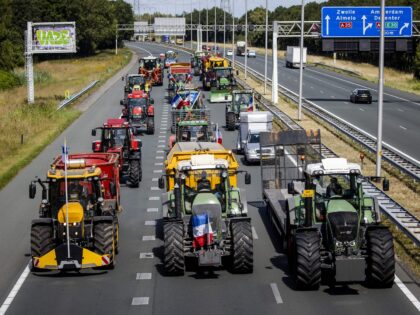 Farmers drive their tractors on the A35 motorway as they protest against the nitrogen plan