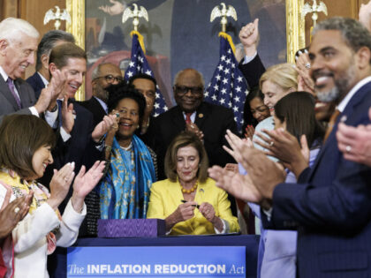 US House Speaker Nancy Pelosi, a Democrat from California, signs H.R. 5376, the Inflation
