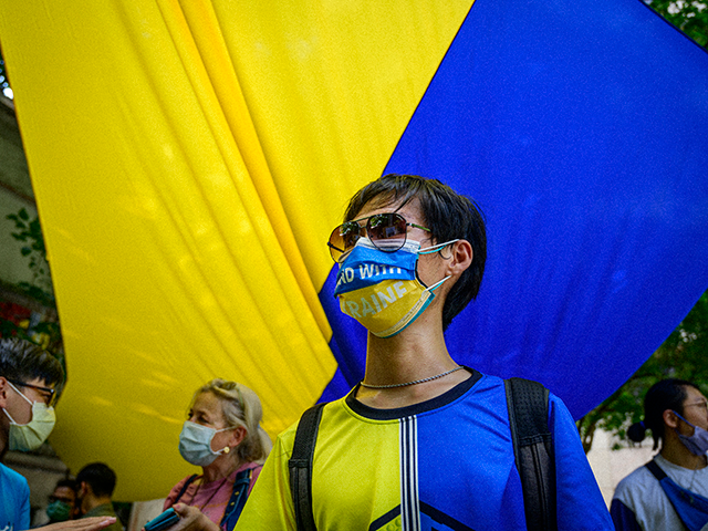 A young Taiwanese dressed with the Ukrainians national colours participate at the Taiwans