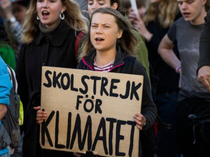 TOPSHOT - Swedish climate activist Greta Thunberg (C) marches during a 'Fridays for Future