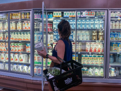 A woman shops for oat milk at a supermarket in Santa Monica, California, on September 13, 2022. - US annual inflation slowed slightly in August, largely thanks to falling gasoline prices -- but likely not enough to satisfy the Federal Reserve and President Joe Biden, as high prices continue inflicting …